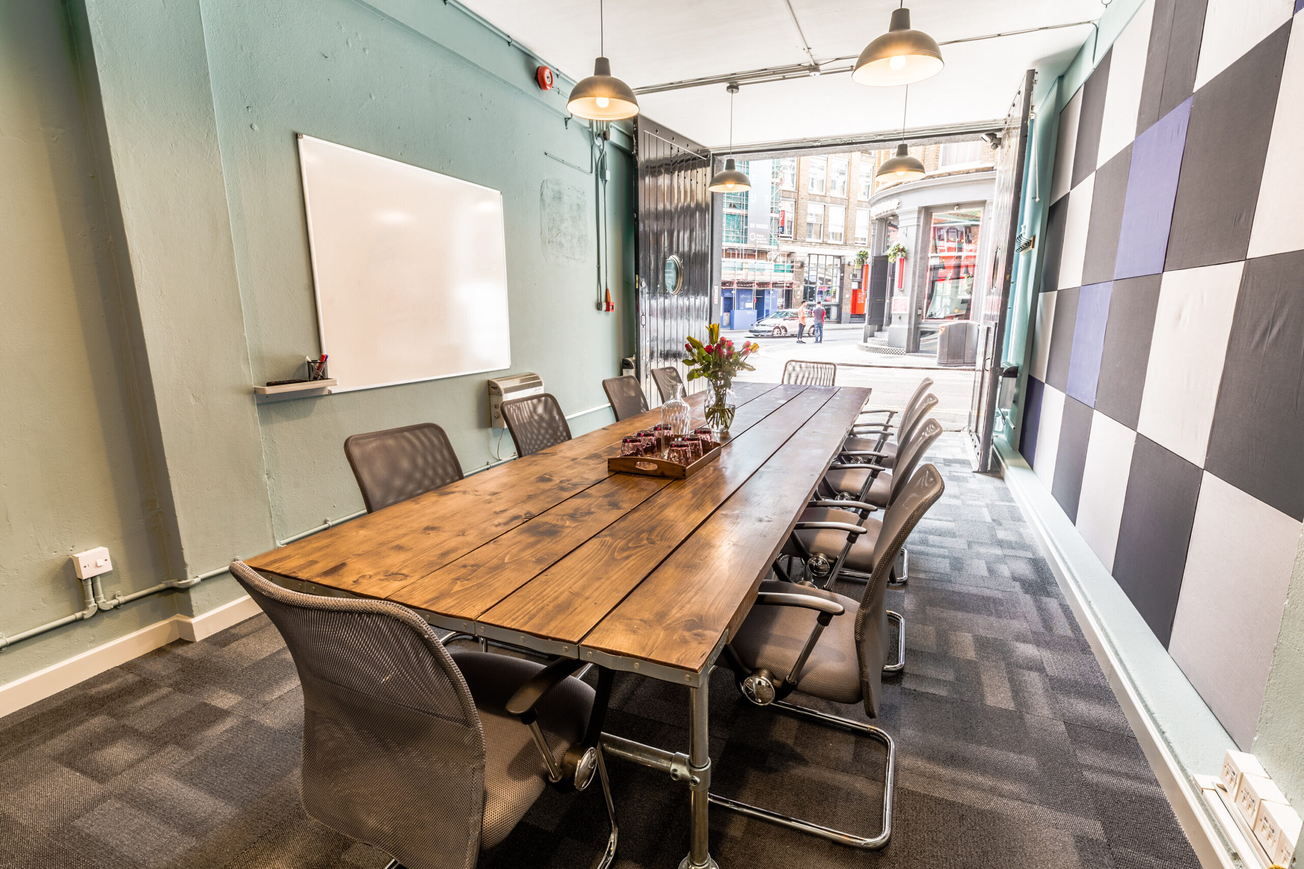 Meeting room with boardroom table and natural light in Shoreditch