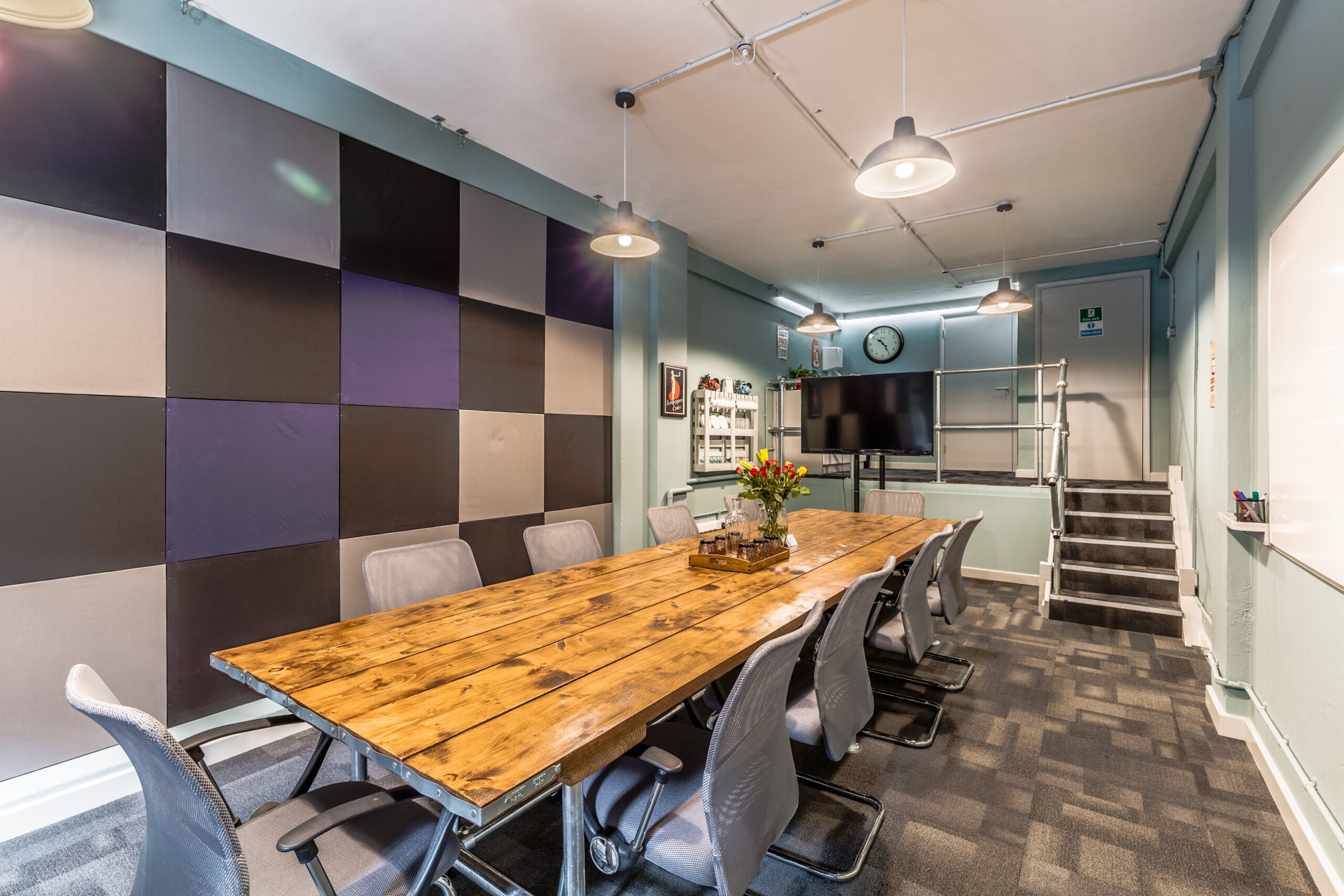 Meeting room with boardroom table and decorative feature wall