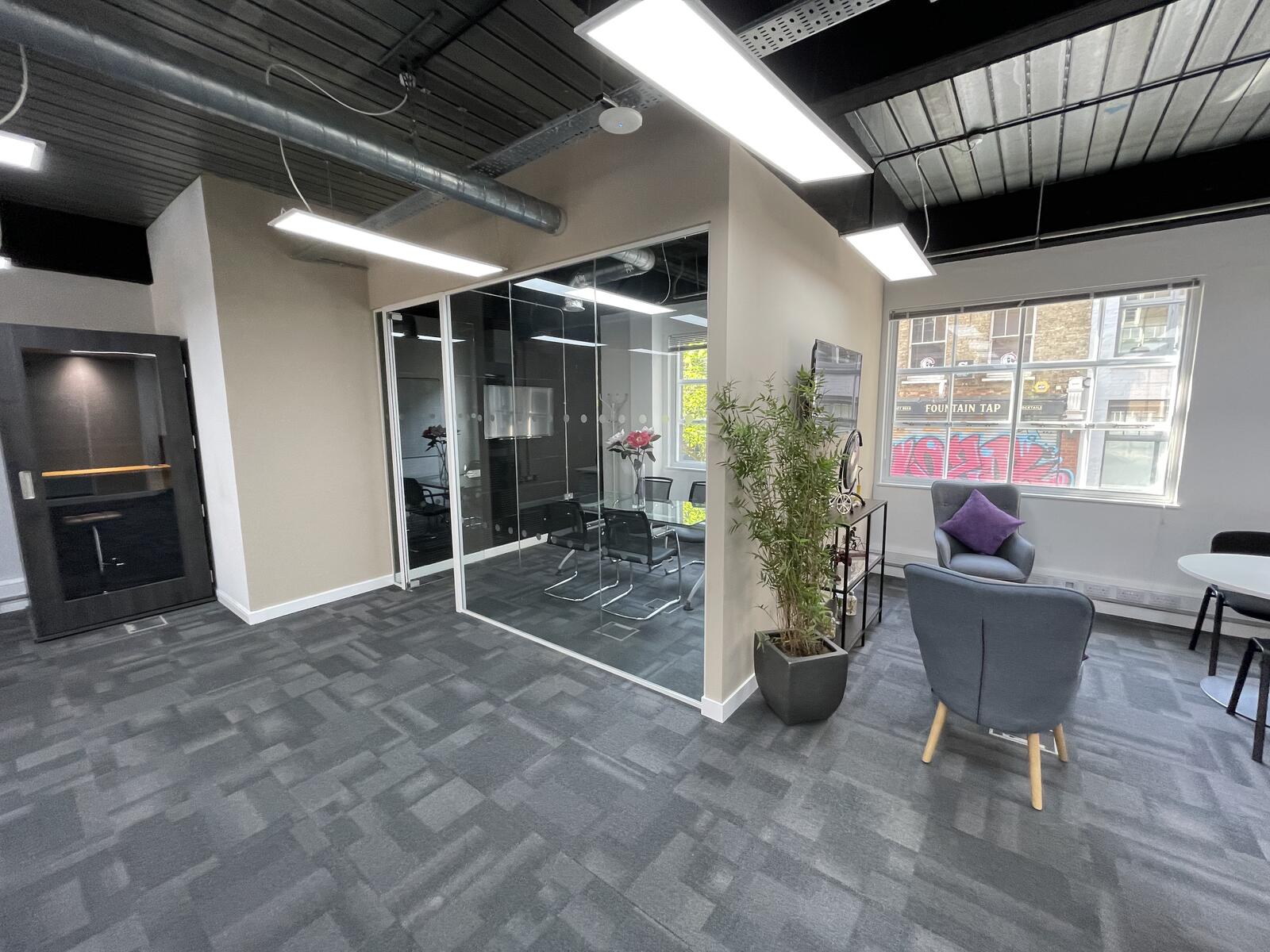 Glass-partition meeting room within Office 1.2 at 2 Bath Place