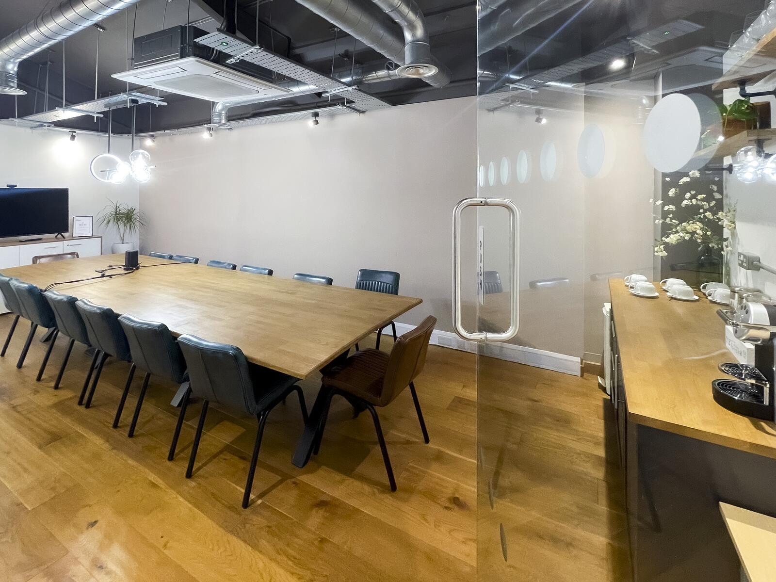 Meeting room with glass walls and natural light in Shoreditch office